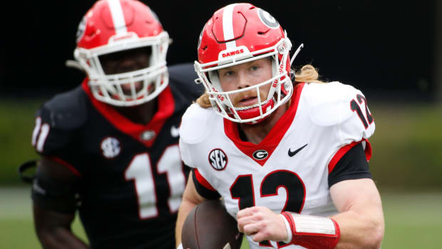Georgia quarterback Brock Vandagriff (12) moves the ball down the field during the G-Day spring football game in Athens, Ga., on Saturday, April 16, 2022. The black team won 26-23. News Joshua L Jones Syndication Online Athens